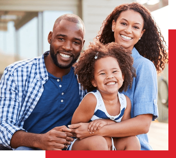 A family of three posing for the camera.