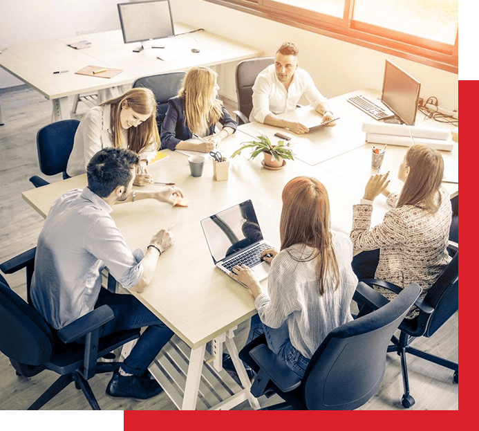 A group of people sitting around a table.