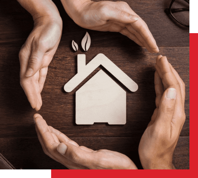 A group of hands surrounding a house with leaves on it.